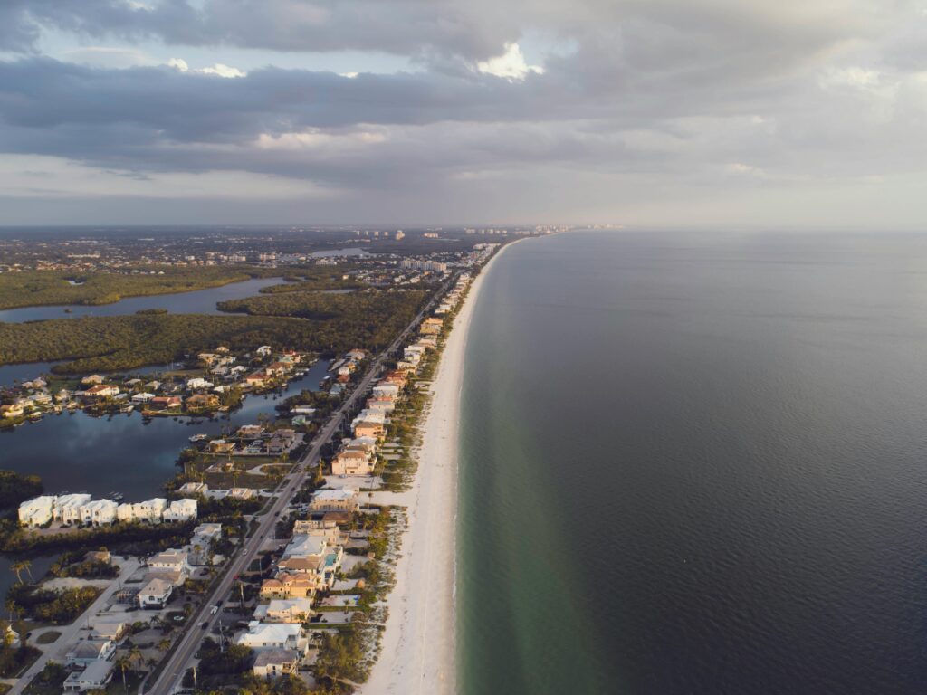 This breathtaking aerial view captures the stunning coastline of Naples Beach.